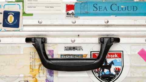 The classic Rimowa suitcase – battered and covered in travel stickers