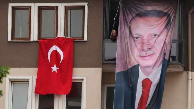A balcony with a banner of Turkish president Recep Tayyip Erdoğan