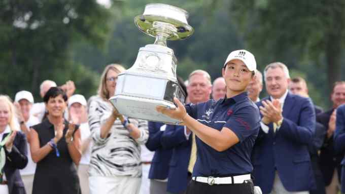 Ruoning Yin of China poses for a photo with the trophy during the awards ceremony after winning the KPMG Women’s PGA Championship