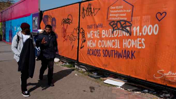 Hoarding in front of council home building project