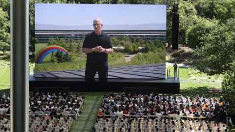 Tim Cook speaks on a stage at the Apple Worldwide Developers Conference in Cupertino on Monday