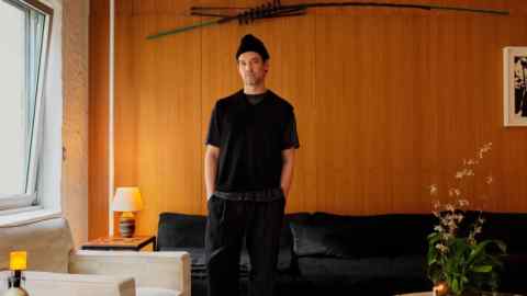 Michael Bargo at home in New York with (on left) his lamp by David Lynch