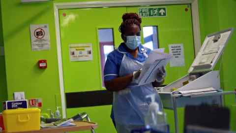 A nurse wearing a protective face mask works at the Royal Blackburn Teaching Hospital in Blackburn, north-west England, on May 14 2020