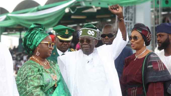 Nigeria’s President Bola Tinubu waves during his inauguration in Abuja