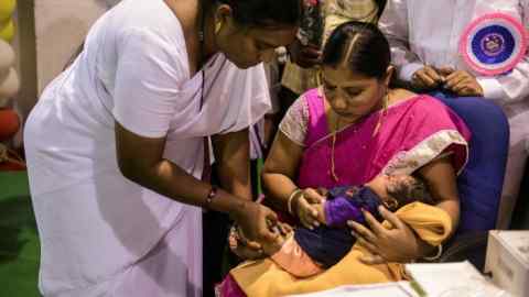 A child in Hyderabad receives a vaccine for five illnesses, including pneumonia