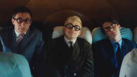 Kasmin, David Hockney and Sheridan Dufferin on a flight from Minneapolis to Chicago, 1965