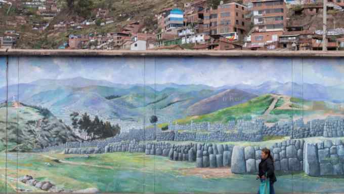 A mural of Inca ruins in Cusco. Peru is split between urban and rural, and north and south