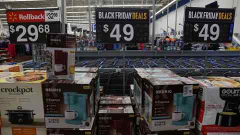Black Friday deals are advertised inside a Walmart.