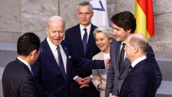 (L-R) Japan’s Prime Minister Fumio Kishida, U.S. President Joe Biden, NATO Secretary General Jens Stoltenberg, European Commission President Ursula von der Leyen and Canada’s Prime Minister Justin Trudeau and Germany’s Chancellor Olaf Scholz before G7 leaders’ family photo during a NATO summit on Russia’s invasion of Ukraine, at the alliance’s headquarters in Brussels, on March 24, 2022 in Brussels, Belgium