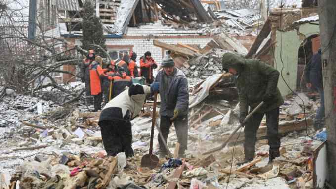 Rescuers clear debris following a Russian strike near Kharkiv, Ukraine, earlier this month