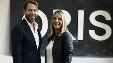 Rolf Studer and Claudine Gertiser-Herzog in front of an Oris sign