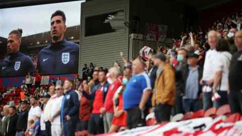 England fans watch the recent match against Romania in Middlesbrough. Supporting the national team is a rare act of unity and duty