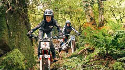 The author’s son Cosmo, left, leads his father on a ride in Devon