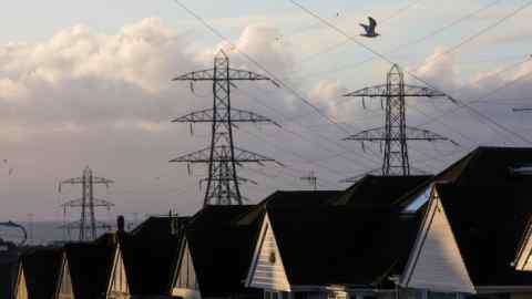 Electricity transmission pylons above houses in Brighton, UK