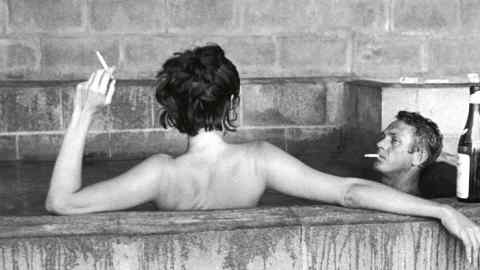 Steve McQueen and his wife Neile Adams in a sulphur bath, Big Sur, CA 1963