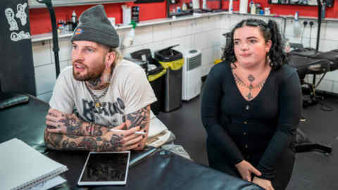 Self-employed body artist Lewis Corps at the Nine Lives tattoo parlour with Natasha Bizouarn