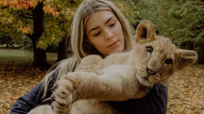 Freya Aspinall with Zemo the lion cub at Howletts Wild Animal Park