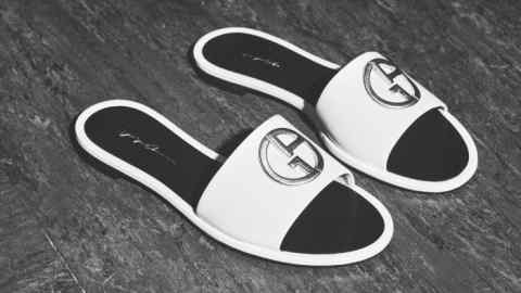 A slipper is a gesture, a symbolic adieu to the outside world… Giorgio Armani leather sandals, £530