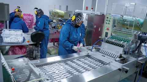 Workers at a syringe production line in Turkey
