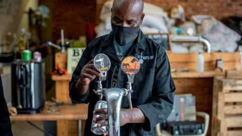 A worker at a South African craft brewery. The country’s drinks industry has been hit hard by the government’s alcohol bans