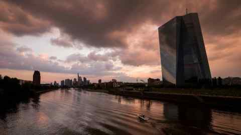 Clouds loom over buildings, including the European Central Bank, in Frankfurt