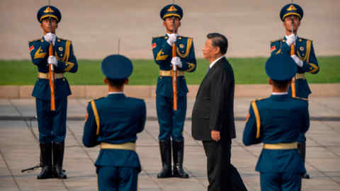 Chinese president Xi Jinping walks past an honour guard in Tiananmen Square in Beijing last month