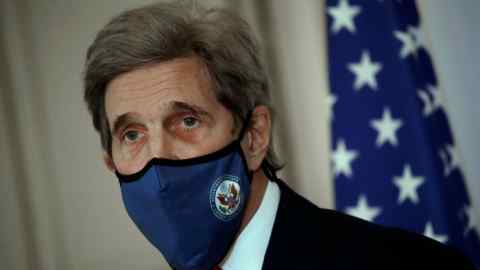 John Kerry wearing a mask