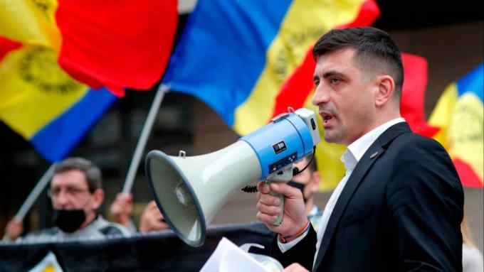 Romanian politician George Simion, the leader of the extremist party Alliance for the Unity of Romanians, delivers a speech  during a protest