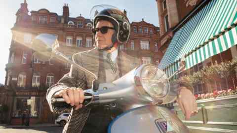 Nick Foulkes gets ready to hit Mayfair on the Vespa Elettrica