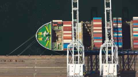 A container ship is loaded with cargo at the Port of Long Beach in Long Beach, California
