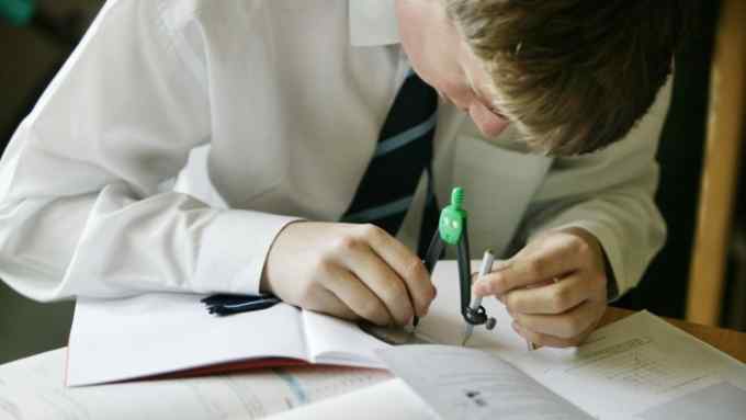 A secondary school pupil in a maths lesson