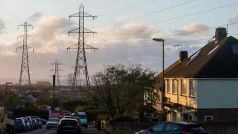 Electricity pylons next to residential houses in Brighton, UK