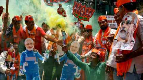 Supporters of Narendra Modi celebrate in Varanasi