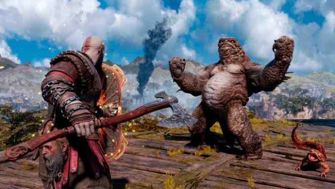 A hefty Norse-ish warrior fights a giant raging scaly monster