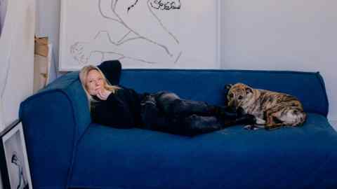 Luella Bartley in her studio with her lurcher Prince