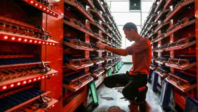 A worker on the production line of a lithium-ion battery factory in Huaibei, China