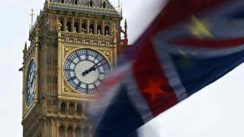 A union flag flies in front of the Elizabeth Tower in Westminster