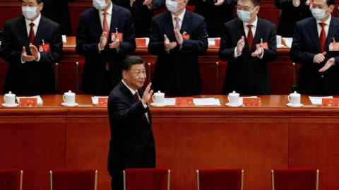 President Xi Jinping waves as he arrives at a national congress of China’s Communist party