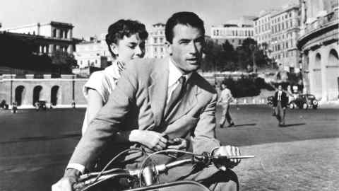 Audrey Hepburn and Gregory Peck on a scooter in Roman Holiday