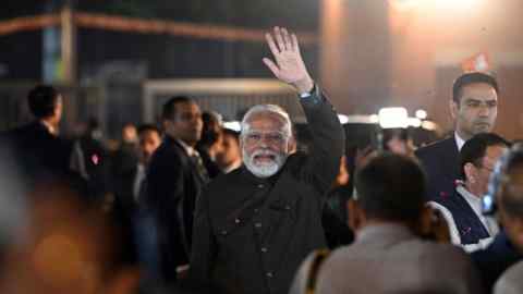 Narendra Modi arrives at his party’s New Delhi headquarters on Sunday