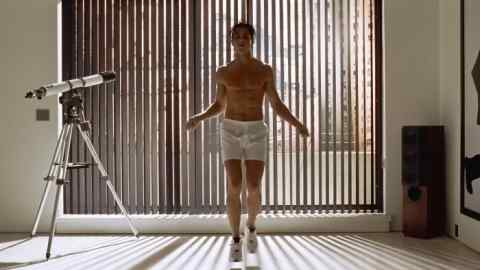 Christian Bale wearing boxer shorts and skipping in American Psycho