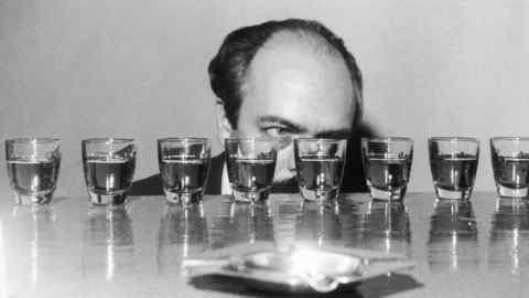 Judge Gaston Berlemont measures entrants at a Scotch pouring championship, 1960