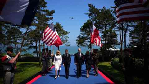 French President Emmanuel Macron with his wife Brigitte, left, and US President Joe Biden and First Lady Jill Biden arrive at the US ceremony marking the Allied landings in Normandy