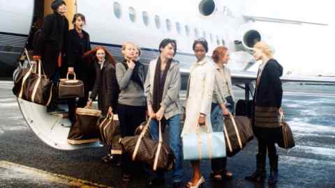 Models including Naomi Campbell, Trish Goff and Kirsty Hume arrive at Paris–Le Bourget airport, 1998