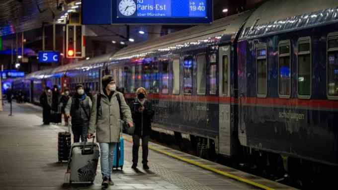 Passengers arrive to board the first Nightjet train between Vienna and Paris at the Central Station in Vienna, Austria