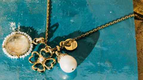 Goossens gold-plated brass, freshwater pearl and crystal charm, £185. Gold-plated brass clover charm, £140. Gold-plated brass and freshwater pearl charm, £170