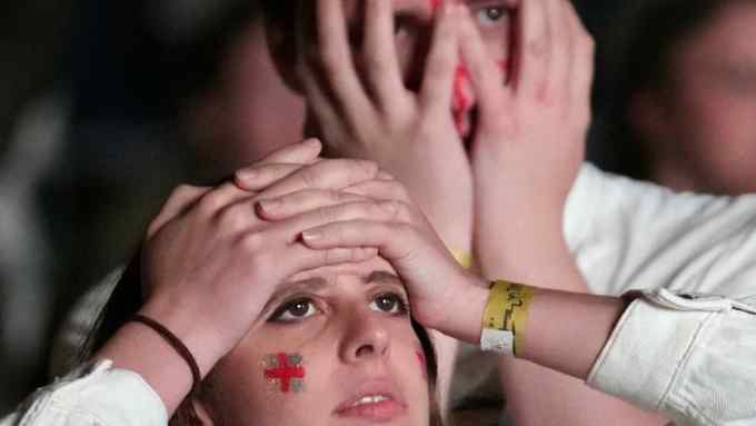 Fans react as England lose the Euro 2020 final against Italy on penalties at Wembley Stadium on Sunday